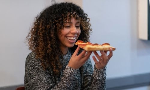 Women Eating thawed pizza