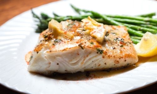 Seared halibut with steamed asparagus